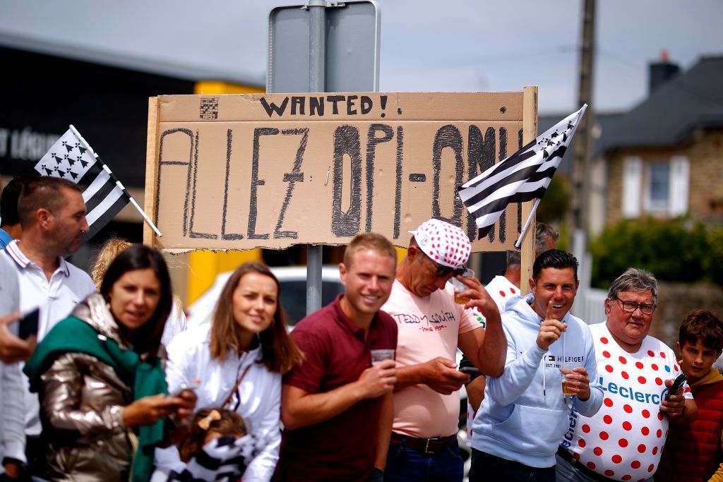 MRDEBRETAGNE GUERLDAN FRANCE JUNE 27 Fans raise a banner saying Allez OpiOmi Come on grandpa and grandma Same message carried by the fan that triggered the massive crash while trying to take a selfie on the Stage 1 during the 108th Tour de France 2021 Stage 2 a 1835km stage from PerrosGuirec to MrdeBretagne Guerldan 293m LeTour TDF2021 on June 27 2021 in MrdeBretagne Guerldan France Photo by Chris GraythenGetty Images