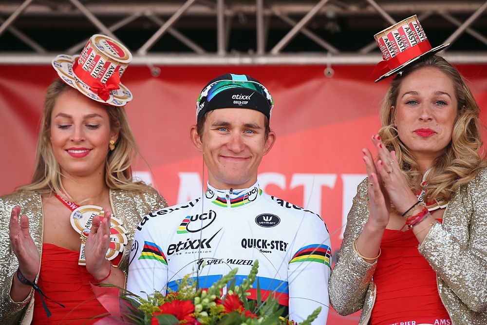 Michal Kwiatkowski (Etixx-QuickStep) celebrates his Amstel Gold Race victory on the podium