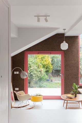 a coral pivot door from the inside of a home