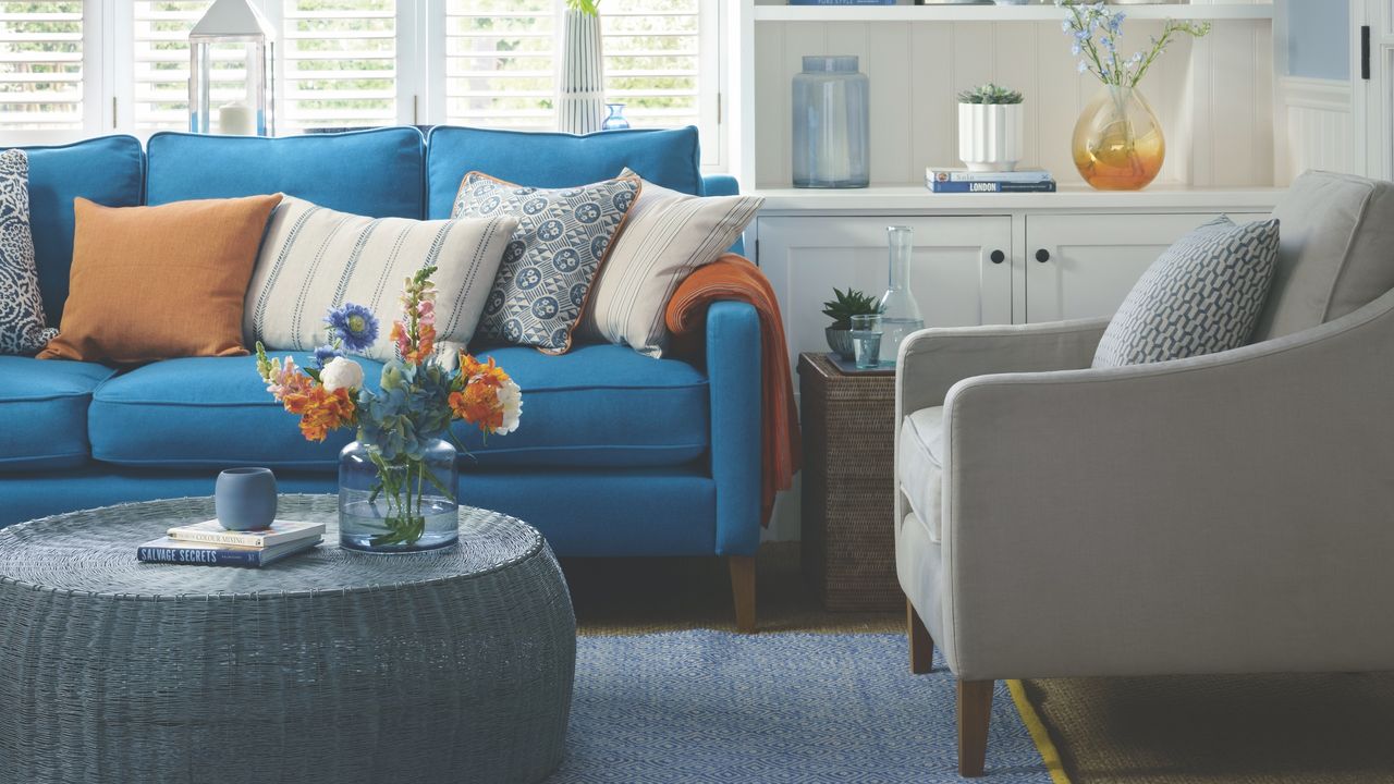 coffee table in living room with blue sofa