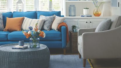 blue living room with white shutters
