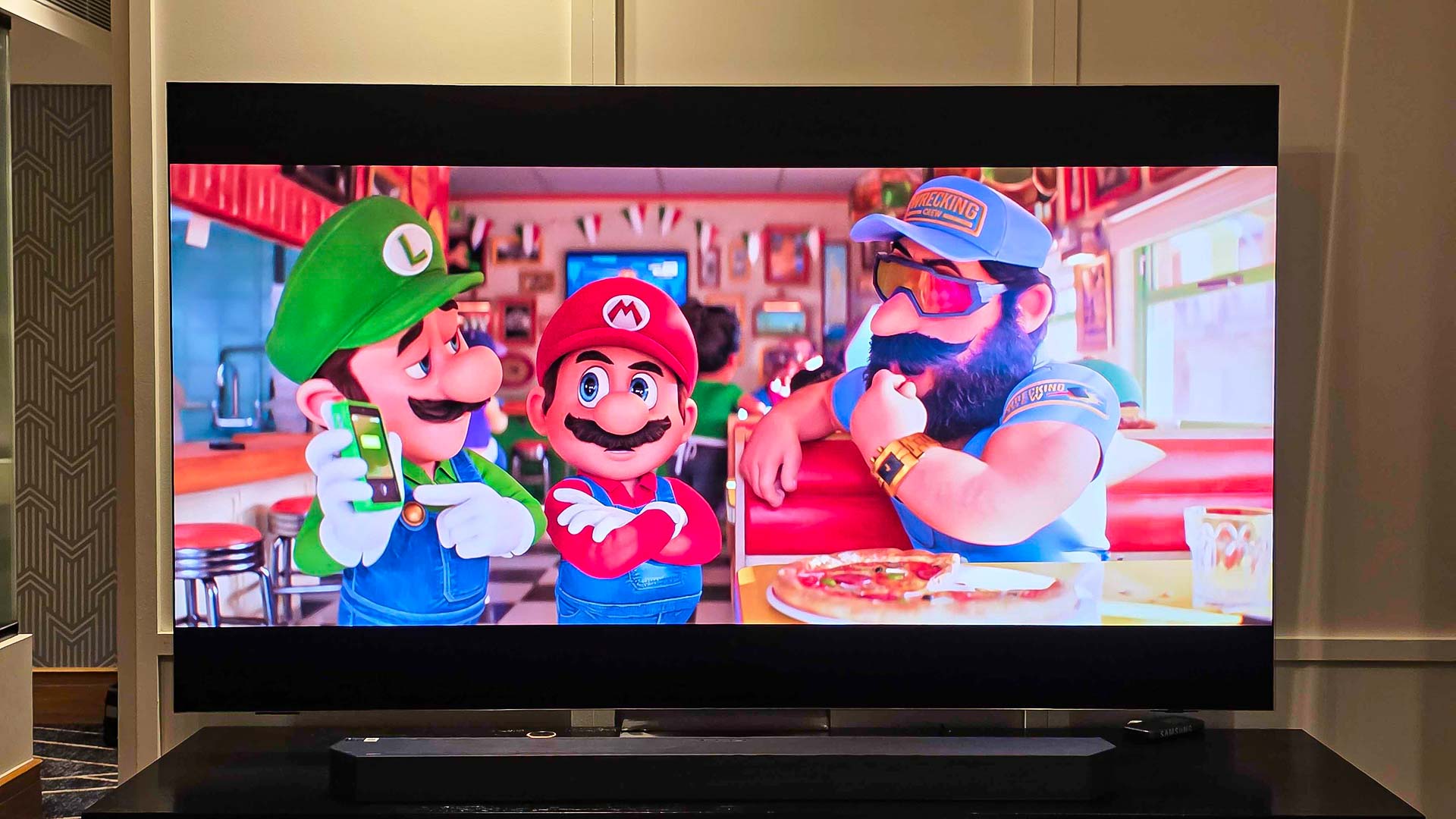 Super Mario Bros. displayed on a Samsung QN990F TV.