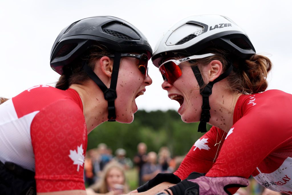 GLENTRESS FOREST PEEBLES SCOTLAND AUGUST 10 LR Second ranked Marin Lowe of Canada and race winner Isabella Holmgren of Canada react after the Women Junior Crosscountry Olympic at the 96th UCI Cycling World Championships Glasgow 2023 Day 8 UCIWT on August 10 2023 in Glentress Forest Peebles Scotland Photo by Dean MouhtaropoulosGetty Images
