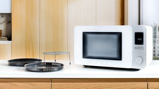 Smeg MOC02 Combi Microwave with accessories on kitchen counter