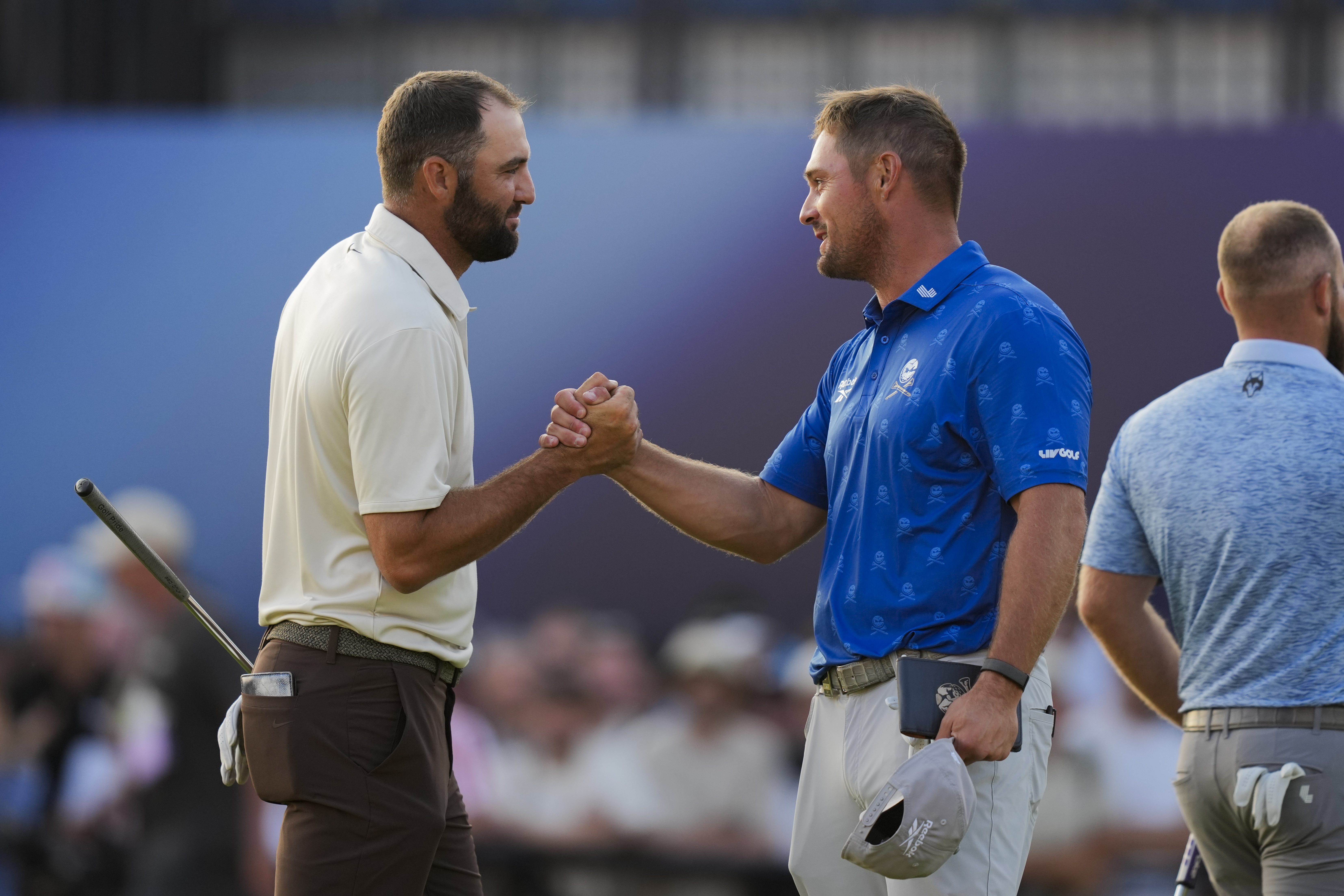 Scottie Scheffler and Bryson DeChambeau shake hands at The Open