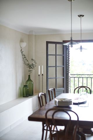 Classic dining area in 16th century French townhouse in Saint-Paul de Vence