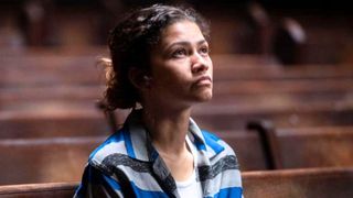 Zendaya looks up at a light source