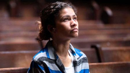 Zendaya looks up at a light source