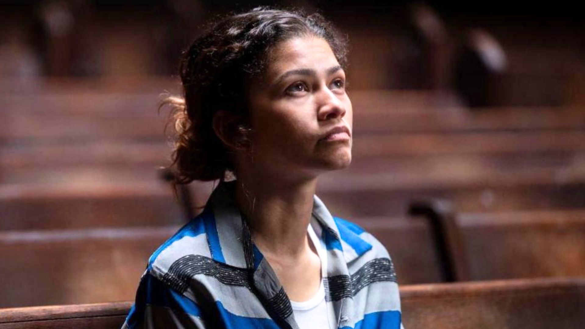 Zendaya looks up at a light source