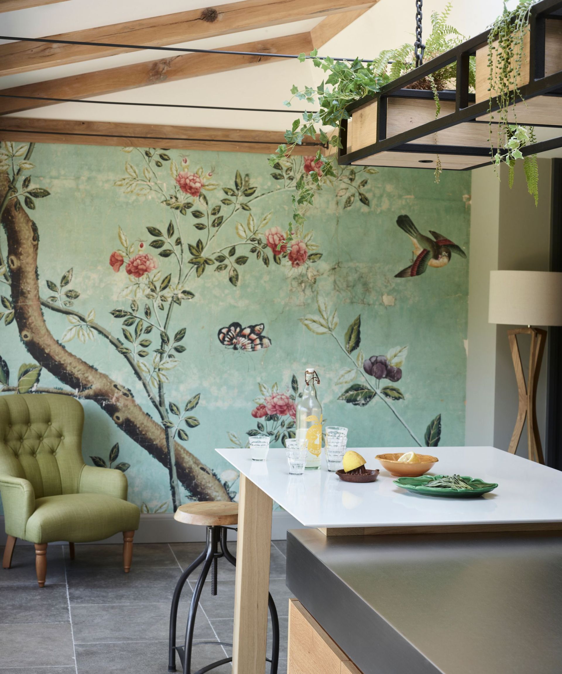 Green kitchen mural behind island