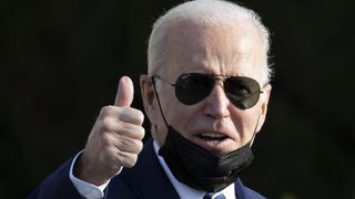 President Joe Biden giving a thumbs up.