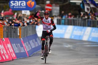 Team UAE Emirates rider US Joe Dombrowski celebrates as he crosses the finish line to win the fourth stage of the Giro dItalia 2021 cycling race 187 km between Piacenza and Sestola EmiliaRomagna on May 11 2021 Photo by Dario BELINGHERI AFP Photo by DARIO BELINGHERIAFP via Getty Images