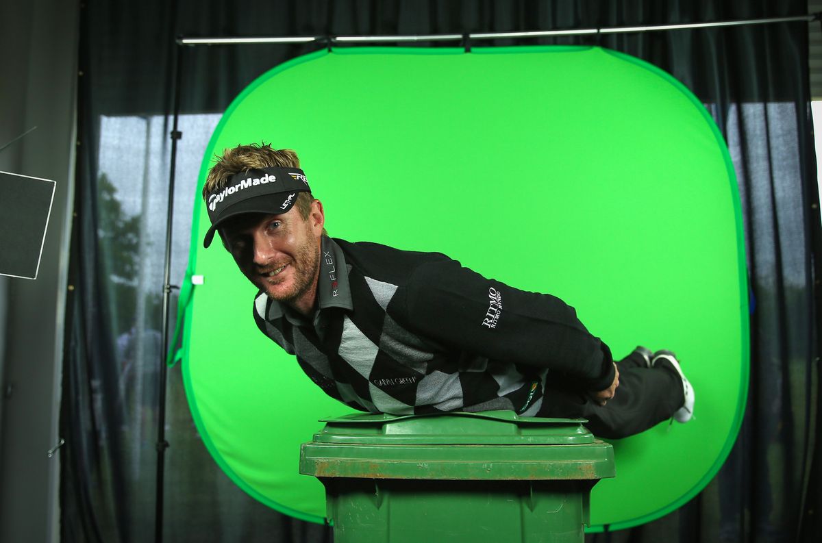 Smiling man standing in front of one of the best green screen backgrounds 