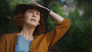 Doctor Mary Malone stares at something off camera as she holds onto her hat in His Dark Materials season 3