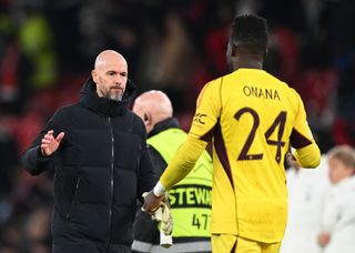 Erik ten Hag, Manager of Manchester United, consoles Andre Onana of Manchester United at full-time after their team's defeat in the UEFA Champions League match between Manchester United and FC Bayern München at Old Trafford on December 12, 2023 in Manchester, England. (Photo by Shaun Botterill/Getty Images)