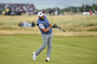 Daniel Brown watches his fairway wood shot from the fairway