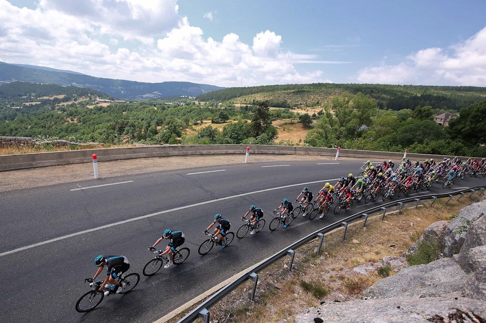 The peloton rolls through the French countryside during stage 15.