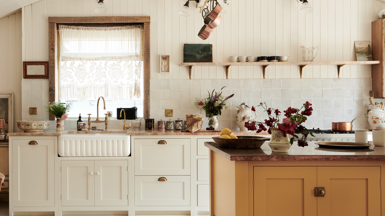 A neutral kitchen with zellige tiles and panelled cabinets