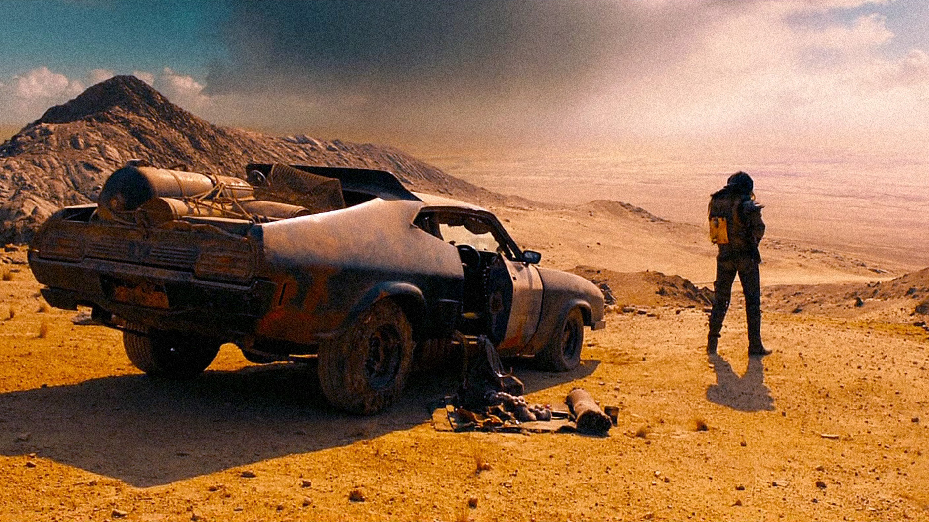 A still from the movie Mad Max Fury Road in which Max (played by Tom Hardy) is looking out at the desert.