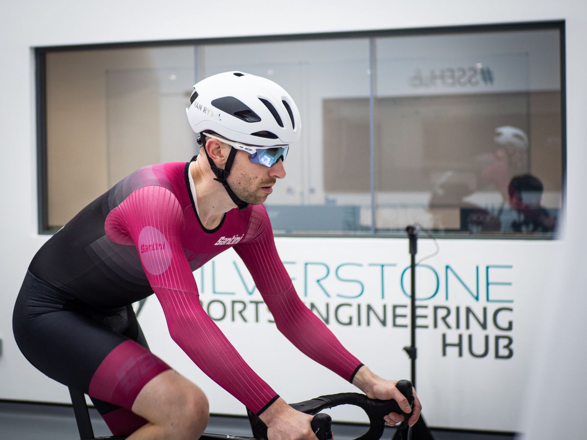 Tom riding in a wind tunnel wearnig the Van Rysel helmet