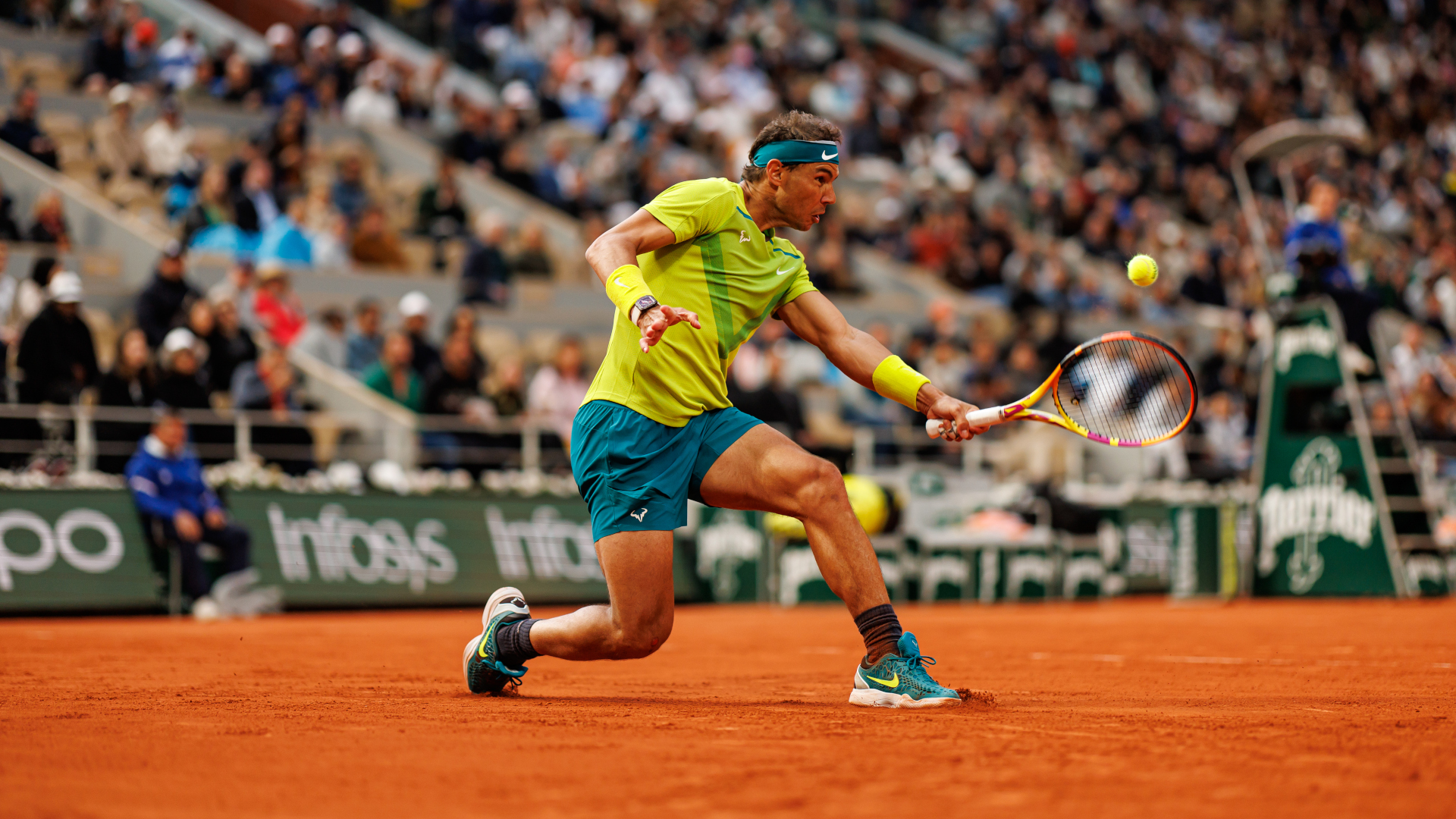 Rafa Nadal digs out a forehand at the 2022 French Open