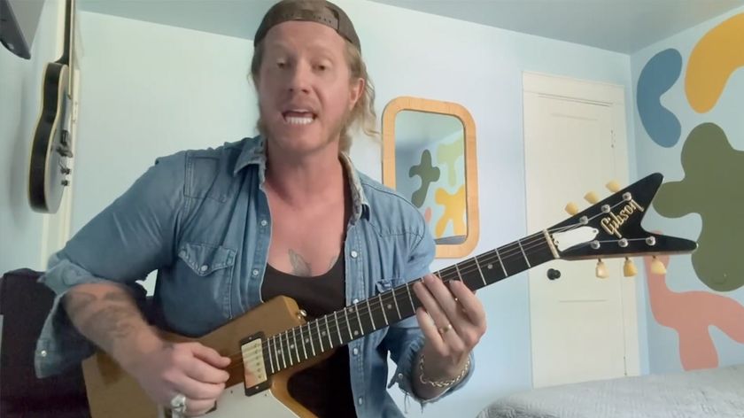 A still from Jared James Nichols&#039; Guitar World video lesson, where he plays an Explorer with a split headstock