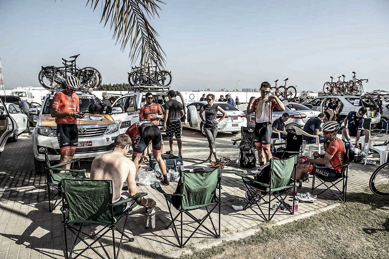 It's hot, there's no shade, the soigneurs are out and the team are getting geared up for the day ahead.