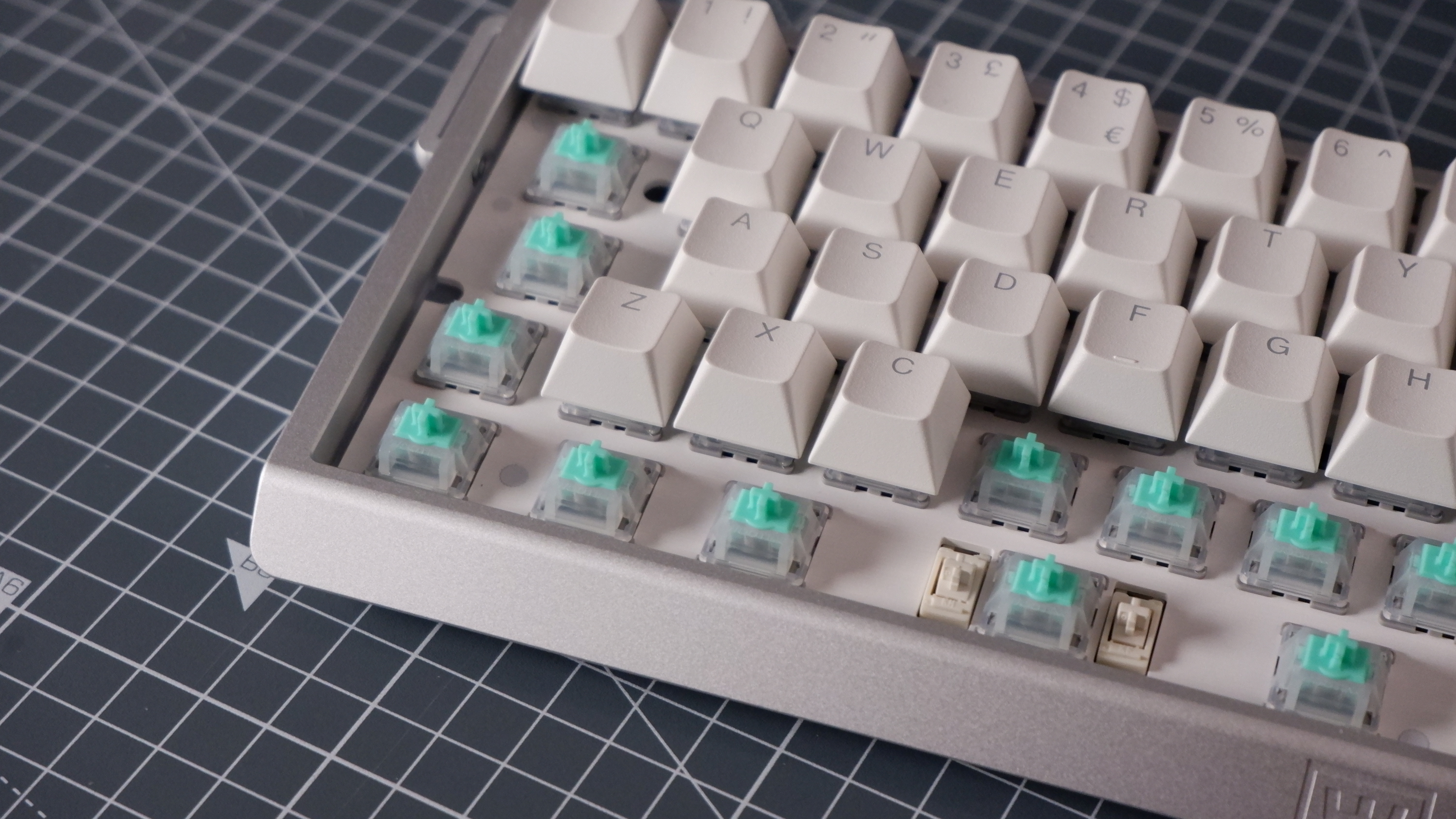 The Wooting 60HE v2 at various stages of being built.