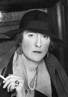 Portrait of British author and gardener Vita Sackville-West, Lady Nicolson (born Victoria Sackville-West, 1892 - 1962), a cigarette in her hand, as she poses in her home at Sissinghurst Castle, Kent, in 1939 Photo by Gisele Freund/Photo Researchers History/Getty Images