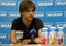 Germany's Linus Gerdemann fields questions at a press conference with this new team, Team Milram.