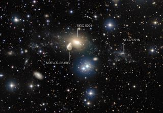 This annotated photo shows the elliptical galaxy NGC 5291 and the unusual dwarf galaxy, NGC 5291N, that formed when another galaxy plowed into NGC 5291's center. It also shows MCG-05-33-005, the Seashell Galaxy, which is also interacting with NGC 5291.
