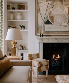 Living room detail with cream colour palette and fireplace