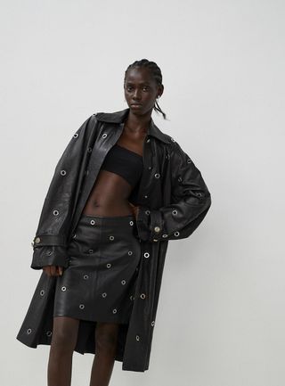 Model wears jacket, bandeau, skirt, by Sportmax