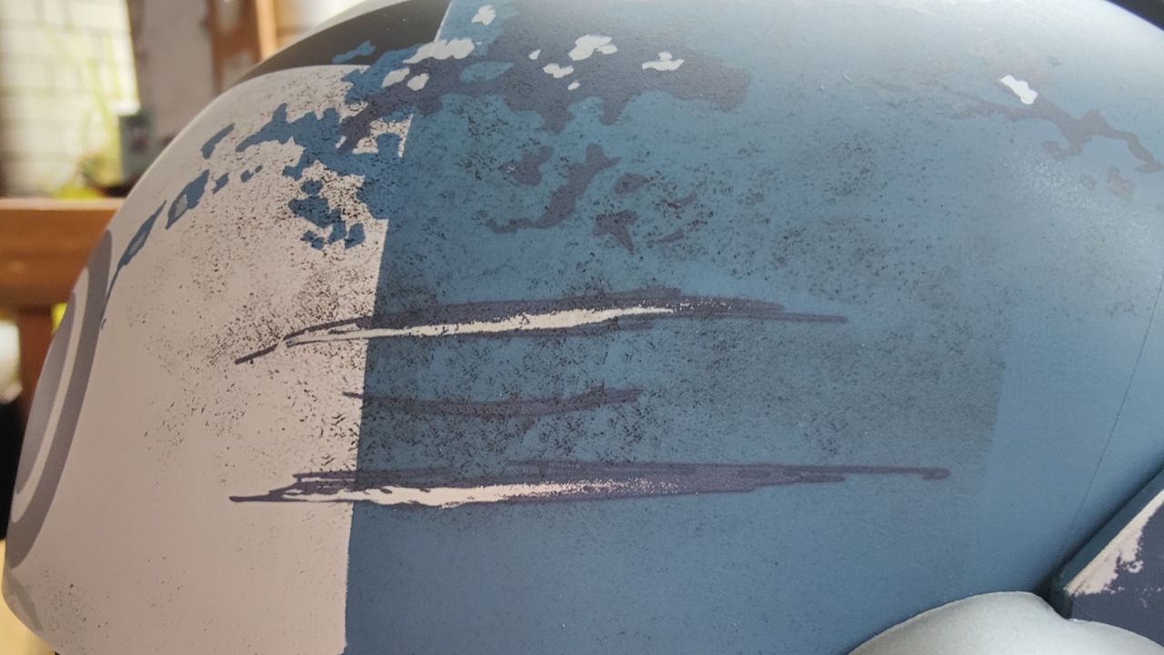 Close up of weathering on the side of the Black Series Bo-Katan Helmet - scratches.