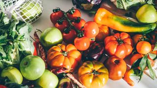 Selection of fresh vegetables, including tomatoes, one way to improve after using the biological age calculator