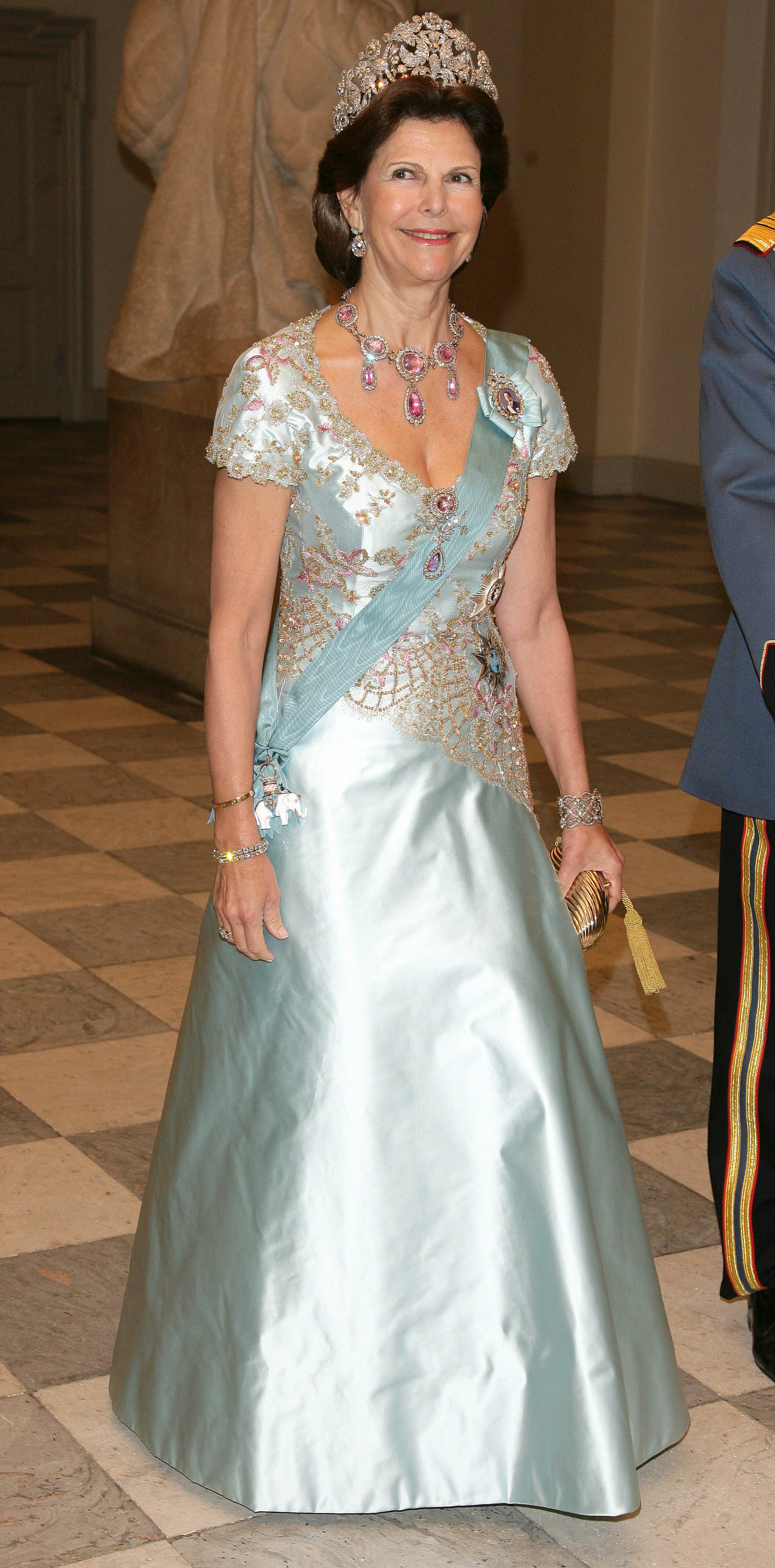Queen Silvia wearing a light blue gown and a diamond tiara in 2007