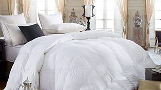 Egyptian Bedding Siberian Goose Down Comforter review: An image of the comforter used in an opulent looking bedroom, surrounded by expensive antiques