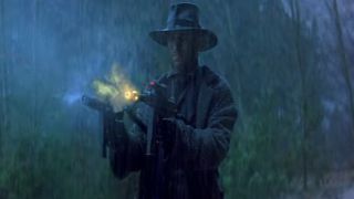 A man with futuristic weaponry in Timecop