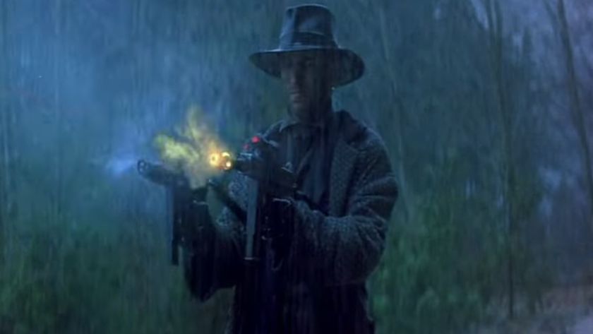 A man with futuristic weaponry in Timecop