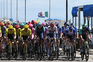 Crazy scenes at Giro d'Italia as lunging spectator menaces peloton - Video