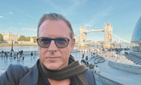 Dom Dawes selfie in front of Tower Bridge and the river Thames