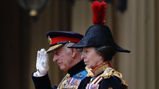 King Charles III, accompanied by Princess Anne, the Princess Royal, presents the new Sovereign's Standard to The Blues and Royals