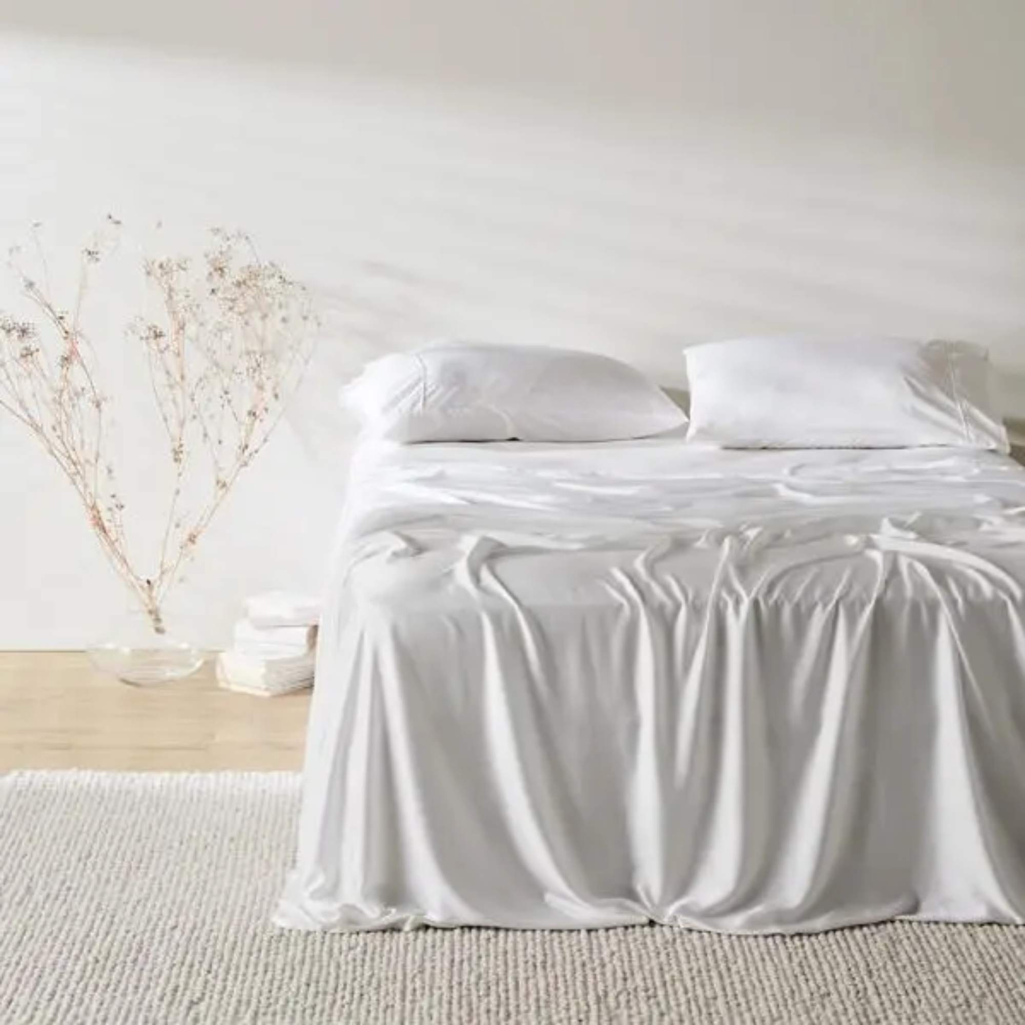 a bed with bamboo sheets on it