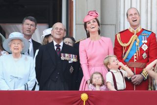 Queen Elizabeth II, Prince Philip, Duke of Edinburgh, Catherine, Duchess of Cambridge, Princess Charlotte of Cambridge, Prince George of Cambridge and Prince William, Duke of Cambridge look out from the balcony of Buckingham Palace