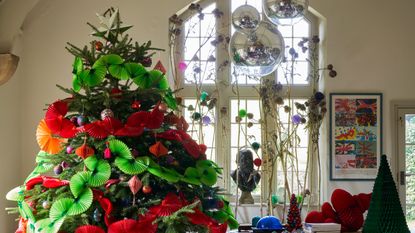 Christmas decorating idea with bright color paper garland around a tree