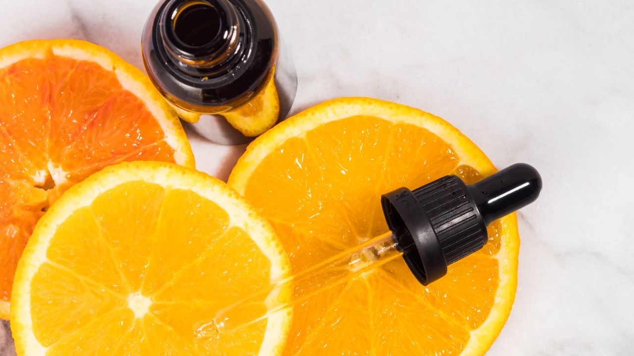 oranges next to a dropper bottle