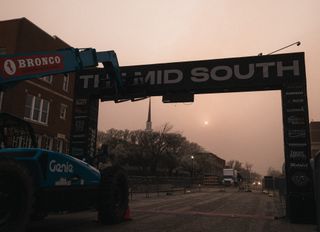 A view of the smoke-filled sky beyond the start/finish of The Mid South in downtown Stillwater