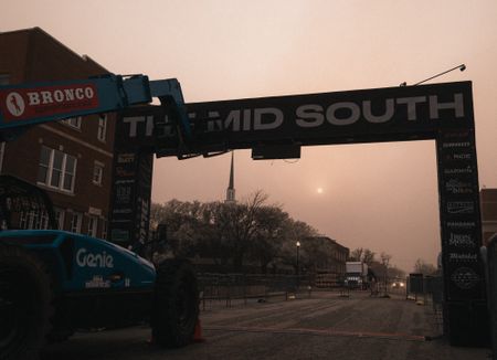 A view of the smoke-filled sky beyond the start/finish of The Mid South in downtown Stillwater