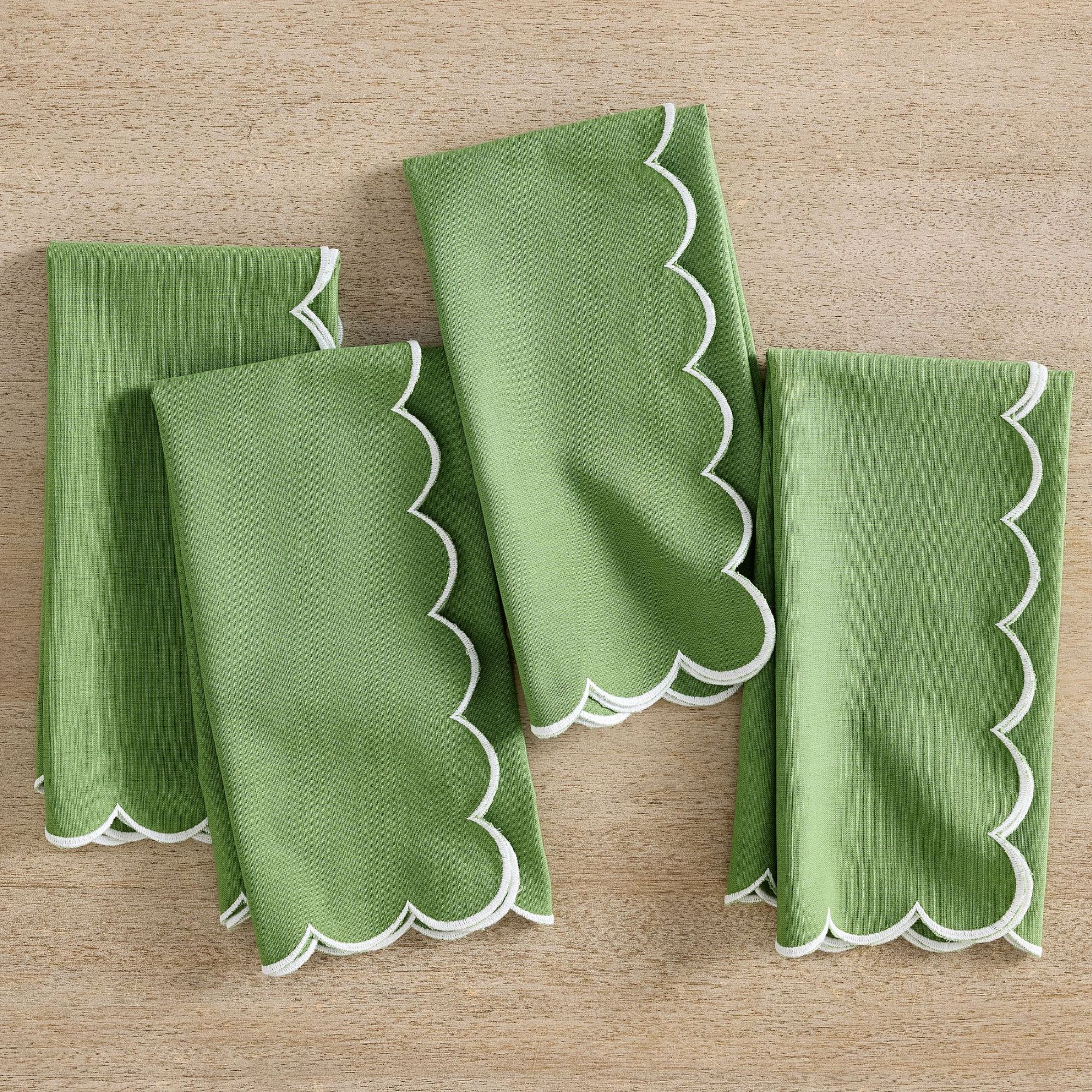 Olive green napkins with a white scalloped edge