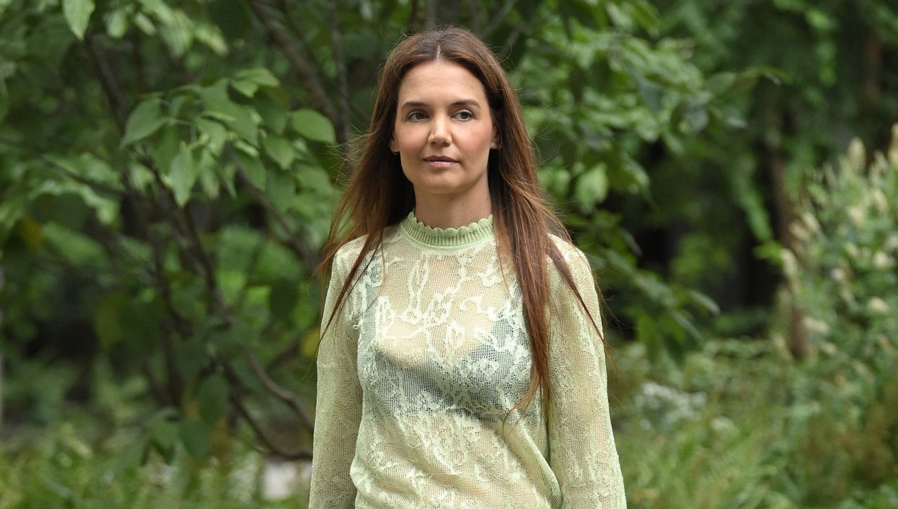 Katie Holmes walks in manhattan wearing a sheer top with an exposed bra and skinny jeans